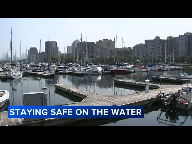 Boats docked at urban marina