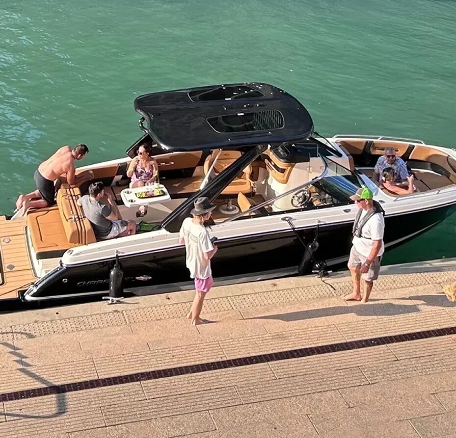 Friends gathered on a black and white boat