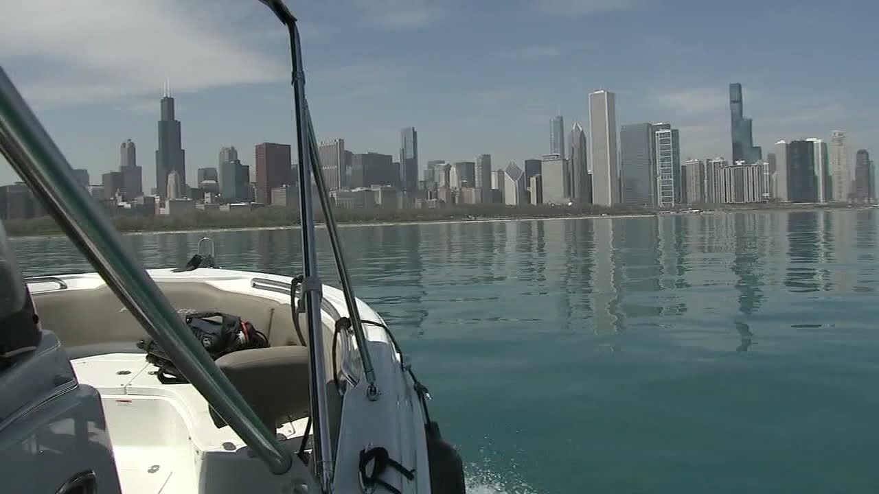 Boat on water with city skyline view