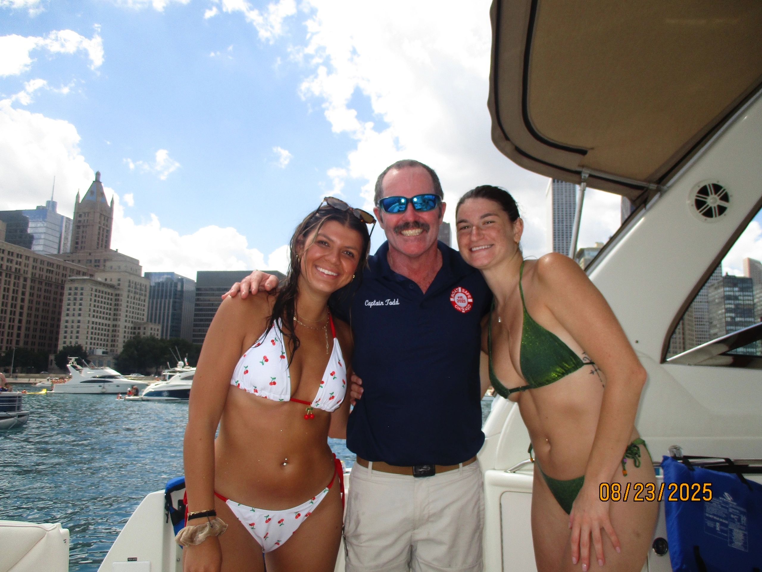 Happy friends enjoying boat trip