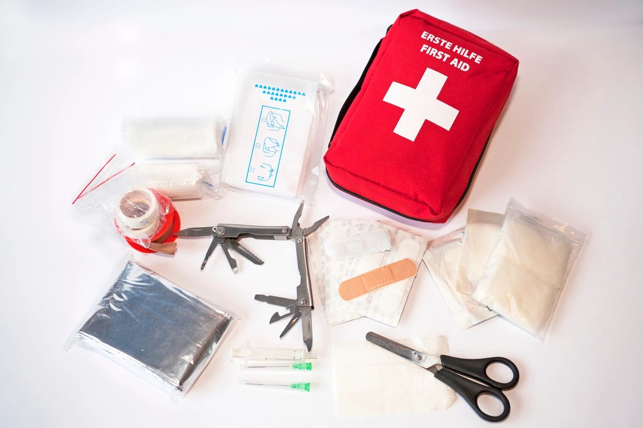 Red first aid bag and tools