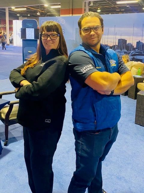 Master Captain Deborah and Master Captain Charlie at the Chicago Boat Show/photo courtesy of Boat Safe Chicago Deborah Nalian charlie Koules boat safe chicago master captains boat instructors boat safe chicago boater safety Master Captain Deborah and Master Captain Charlie at the Chicago Boat Show/photo courtesy of Boat Safe Chicago Deborah Nalian charlie Koules boat safe chicago master captains boat instructors boat safe chicago boater safety