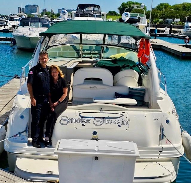 Captain Kevin with his wife and business partner Rebecca on their charter boat/ photo courtesy of ChiTown Boat Charters Kevin Molitor captain kevin rescues boat safe chicago boat charters