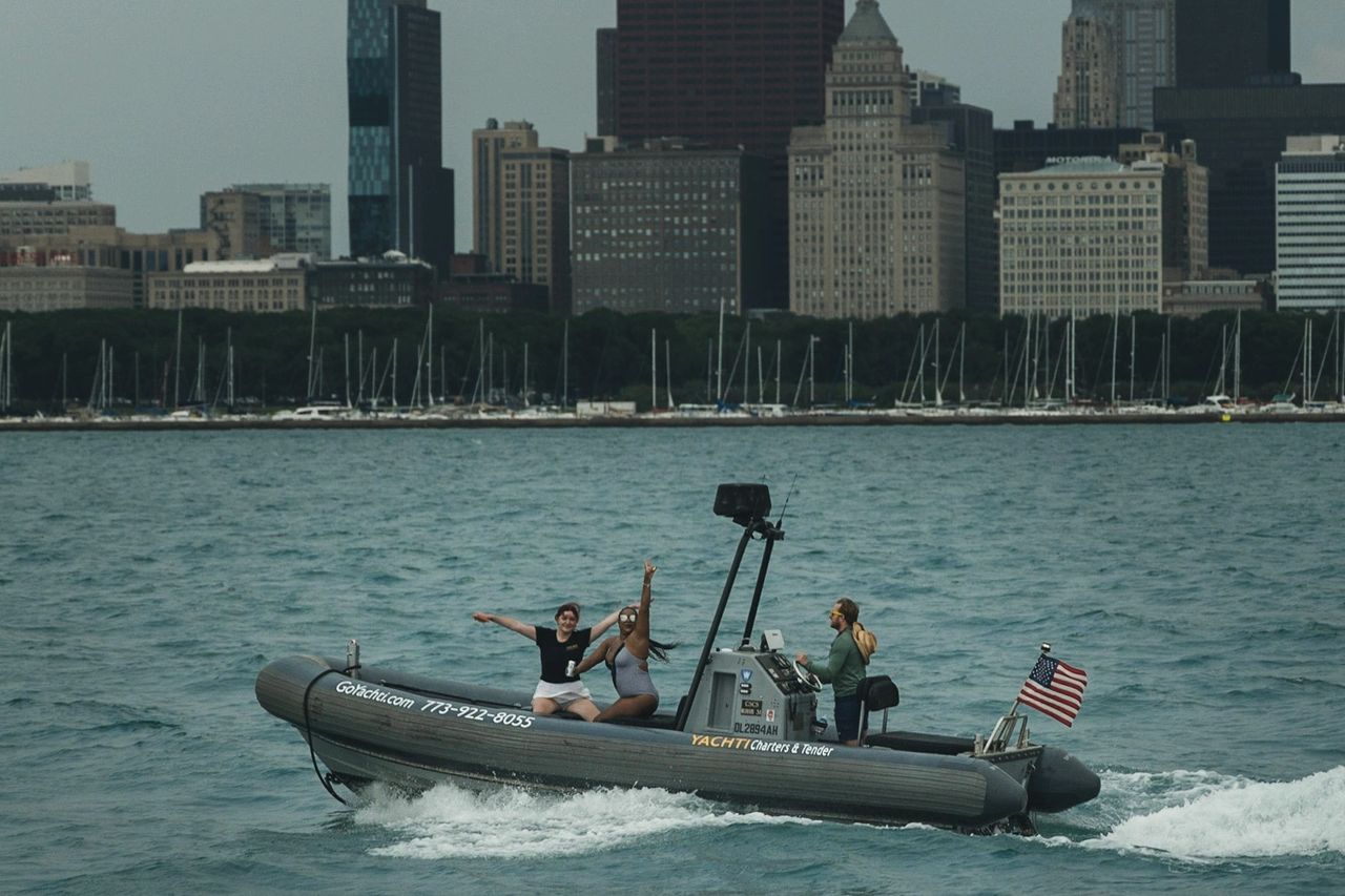 Liam Poczatek driving guests from the Playpen Lake Michigan Chicago Yachti