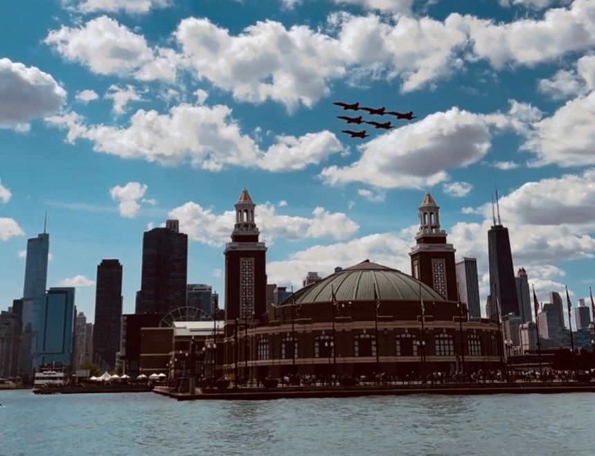 Jets flying above iconic cityscape