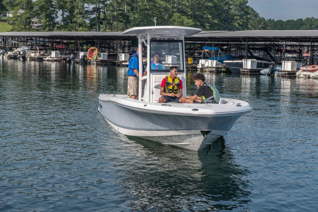 Small boat on lake near docks