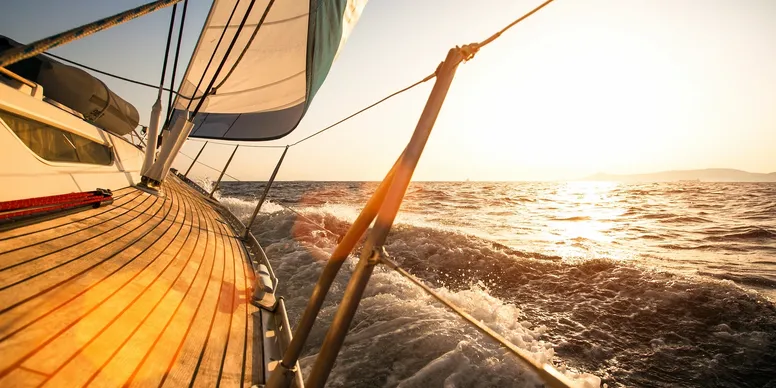 Wooden deck of yacht at sunset