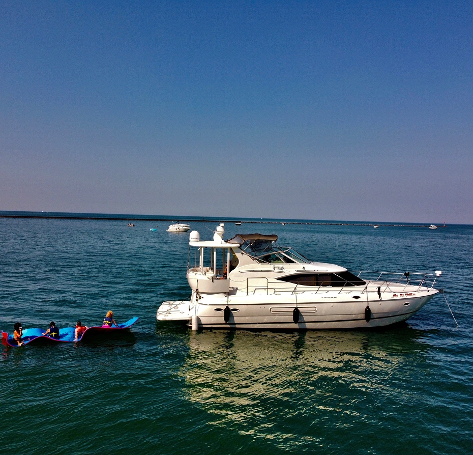 White boat floating on top of a body of water