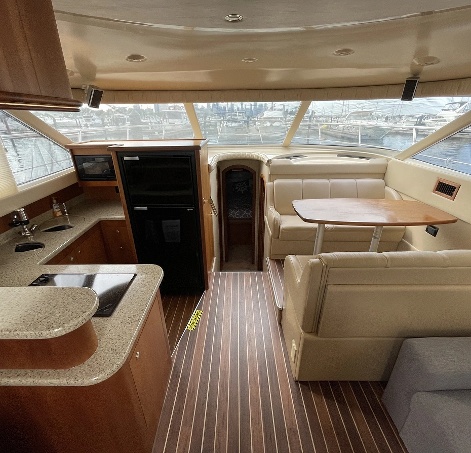 350 Coupe, with a sofa, table, cupboards, sink, tap, and other objects on the left side