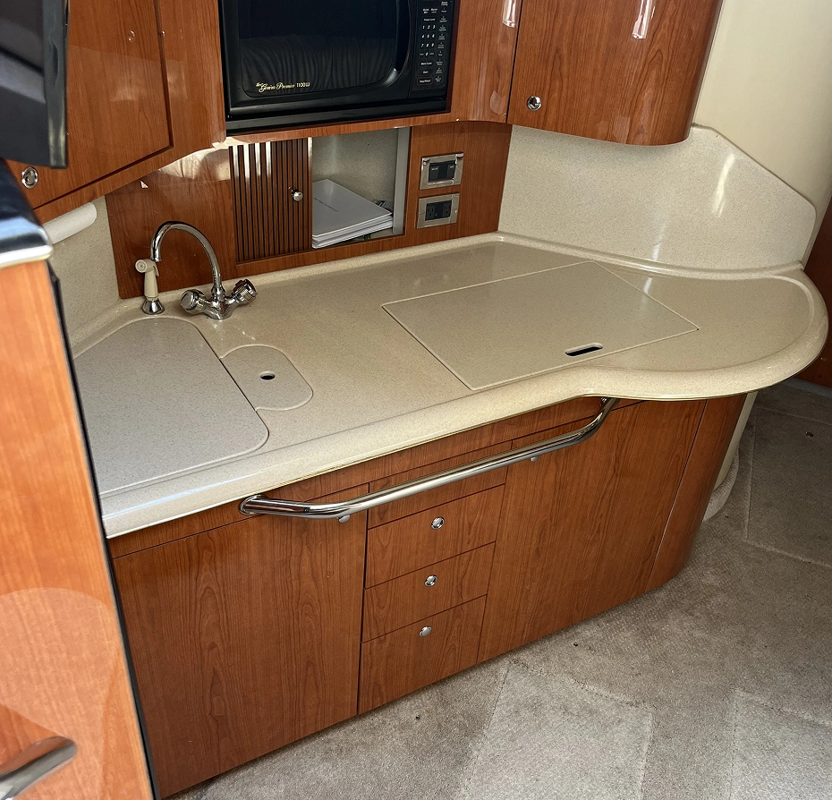 Kitchen with a sink, microwave, and cabinets