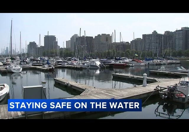 Boats docked at urban marina