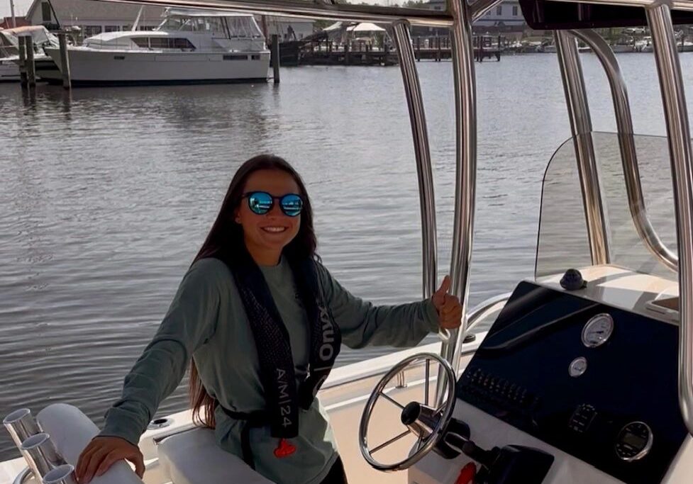 Smiling woman on a boat