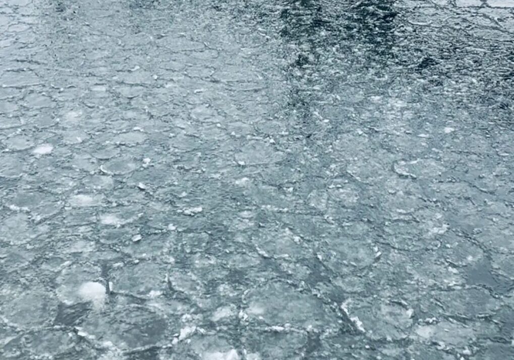 Frozen lake with wooden pier