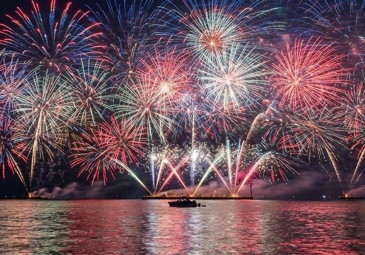 Colorful fireworks over a lake at night.