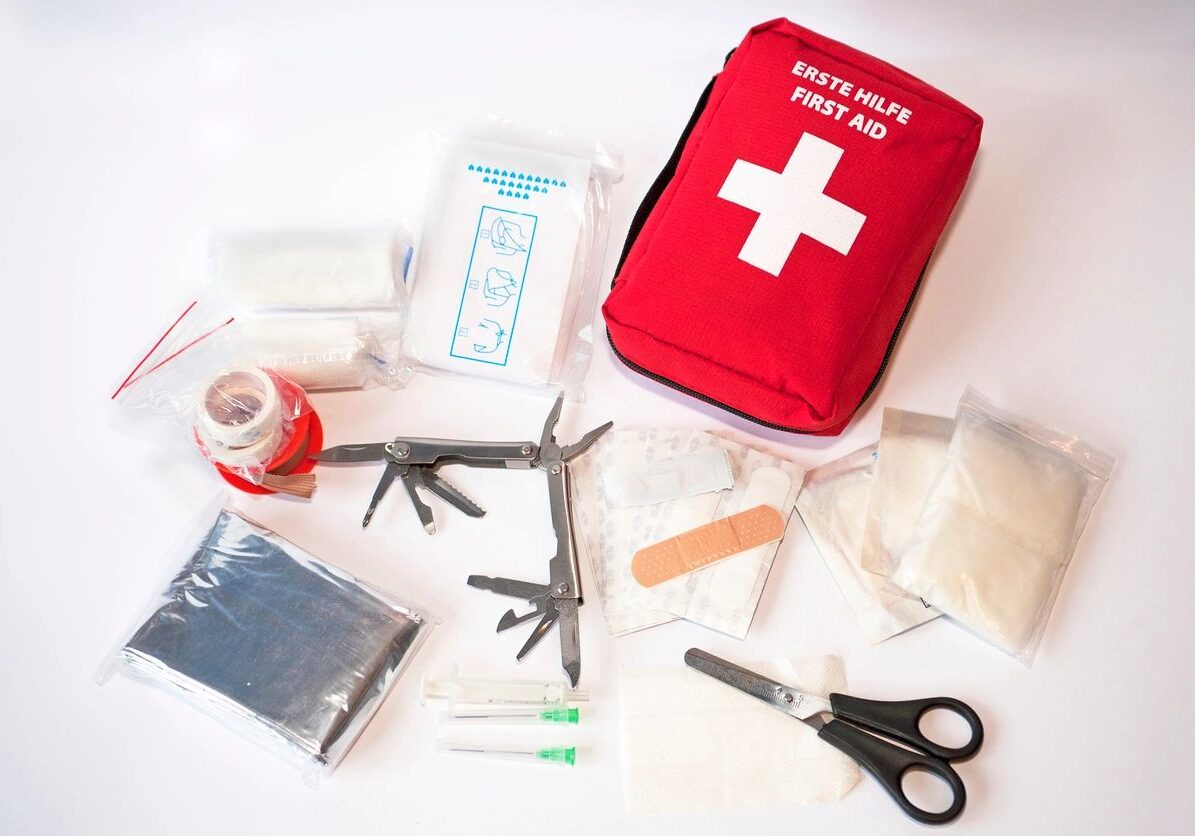 Red first aid bag and tools