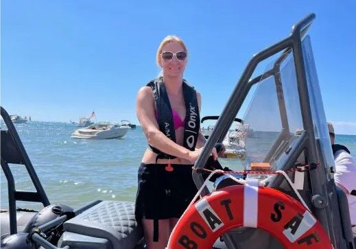 Boater beside a Boat Safe Chicago life ring