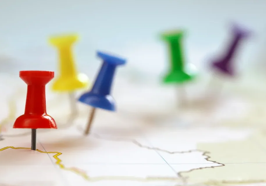 Map with multicolored push pins