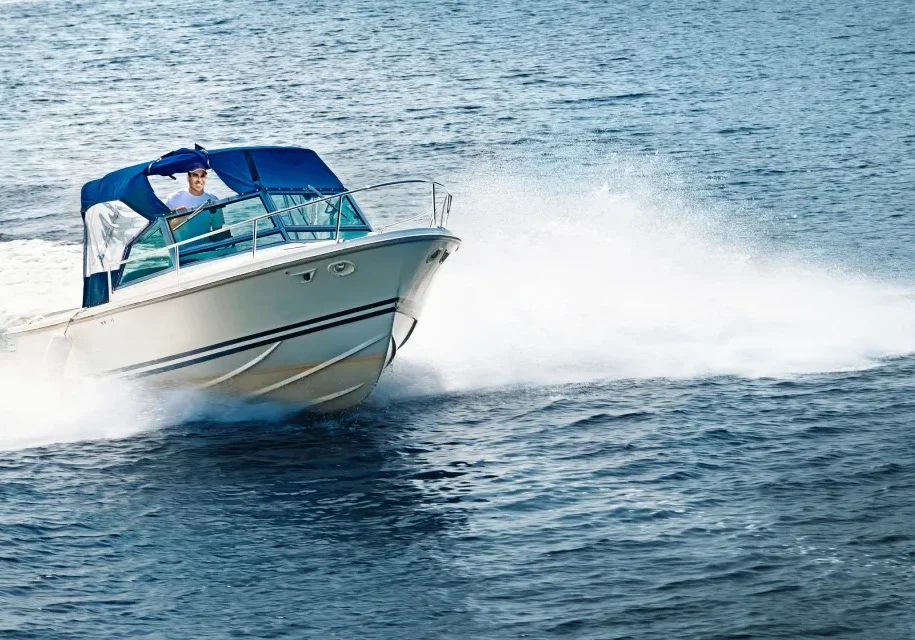 Motorboat with blue canopy in action