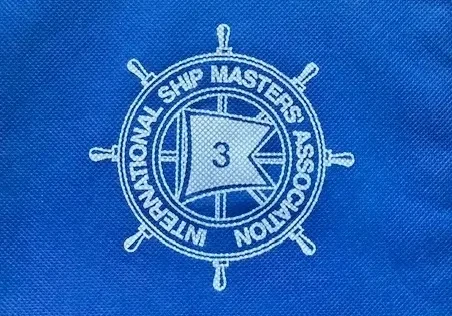 Chicago Shipmasters Association emblem embroidered on a blue shirt